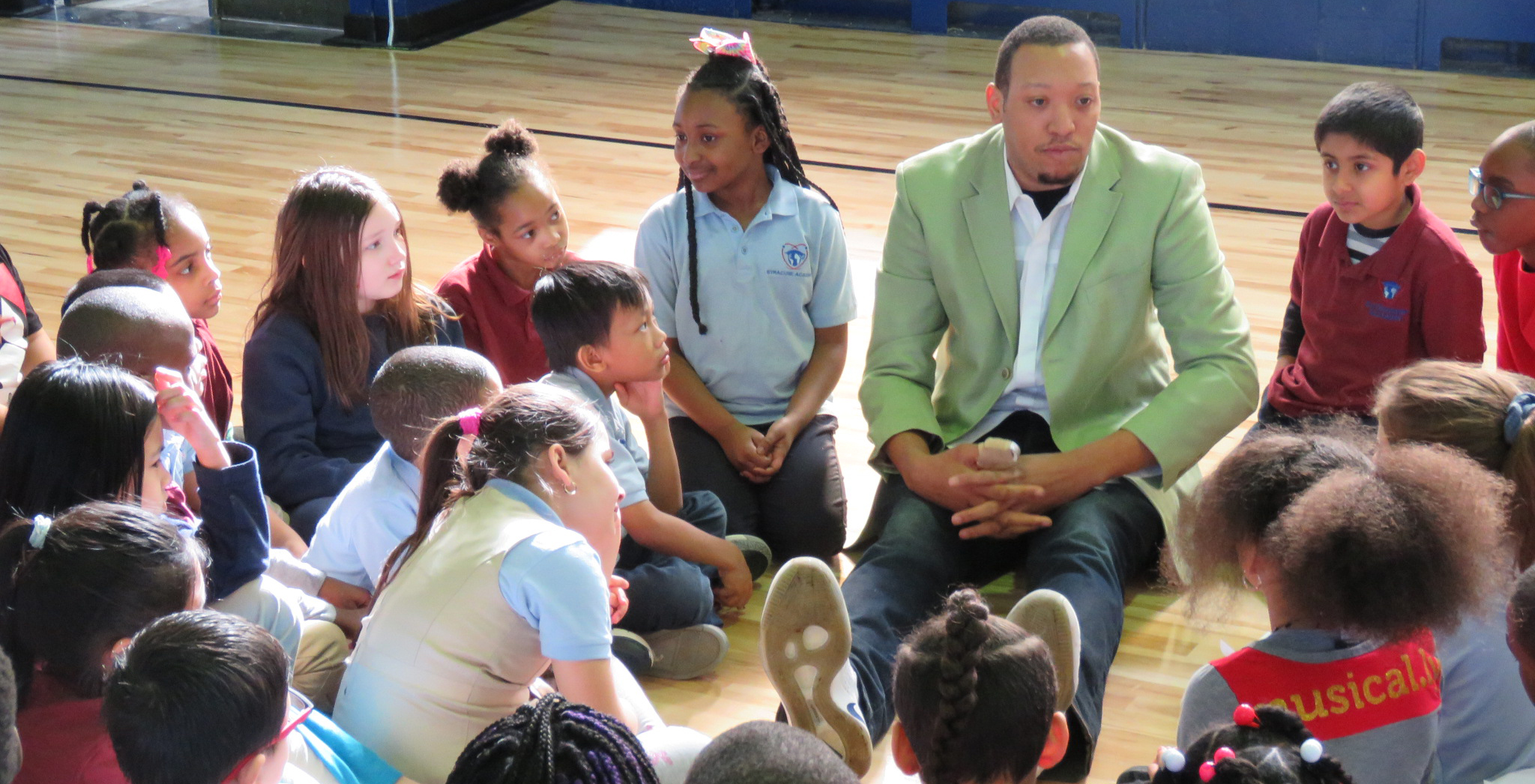 Former Syracuse University Basketball Player Mookie Jones Sits with Citizenship Academy Scholars during Black History Month