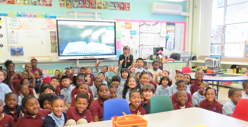 Guest Speaker, Honorable Judge Brenda Sannes reads the book, We’re All Wonders by R.J. Palacio to the first grade Atoms