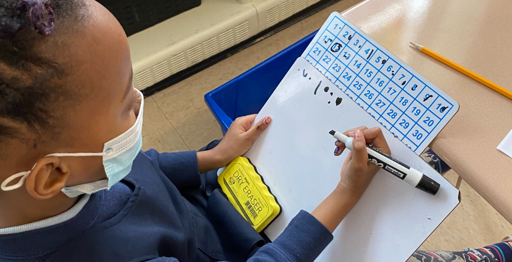 Syracuse Academy of Science and Citizenship first grade Atoms practice their strategic thinking skills when solving various subtraction problems on their math worksheet.