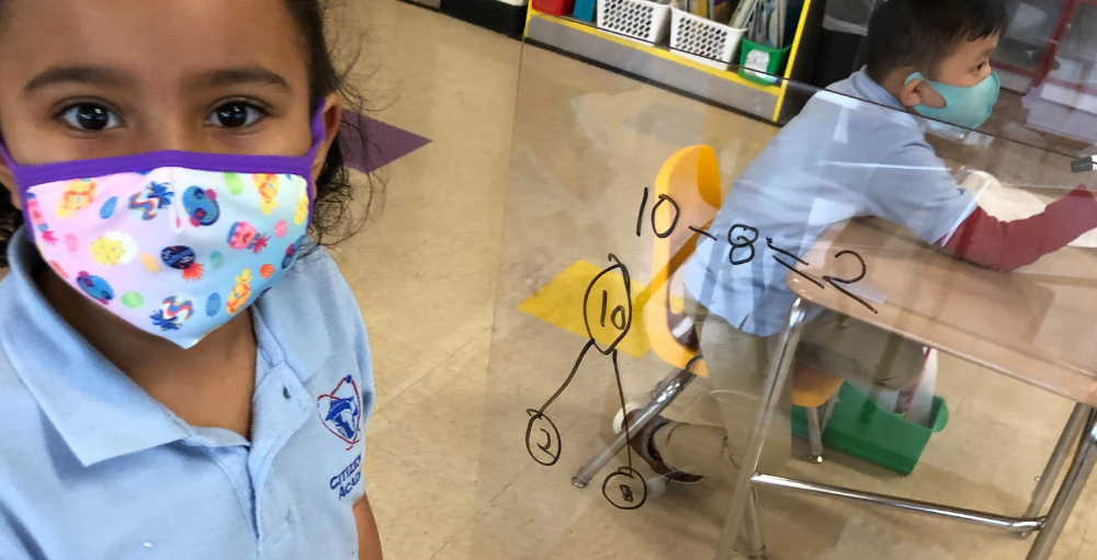 Syracuse Academy of Science and Citizenship students use their clear whiteboard dividers for a hands-on, minds-on learning experience.