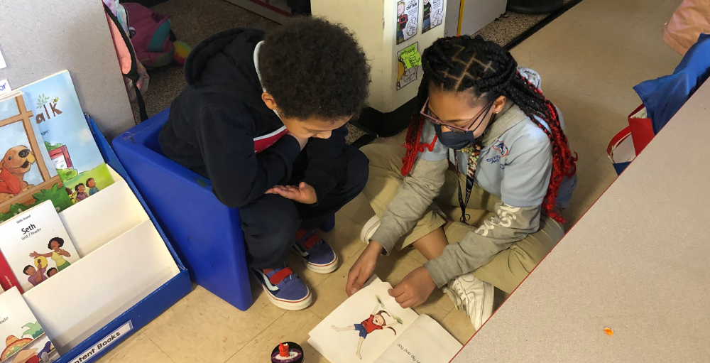 It may be true 'Atoms fashion' to help one another, but this young student has made a lasting impression on many younger students by volunteering her time as a classroom helper. Syracuse Academy of Science and Citizenship elementary school's sixth-grade student, Luli, has dedicated a portion of her day to spending time as a classroom helper and assisting the younger students with their reading. As a classroom helper, Luli reads to the students and asks them questions about the storybooks. Luli has been an excellent addition to the classroom and is an incredible role model for all the students. We love her presence in the classroom.