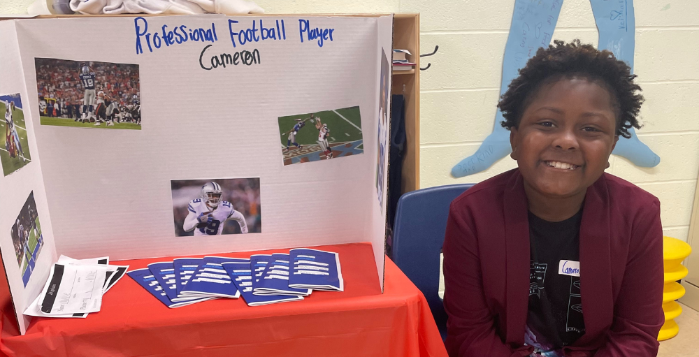 Syracuse Academy of Science and Citizenship elementary school Atoms create informational brochures and posters to present to classmates about their dream career during the Career Fair event.