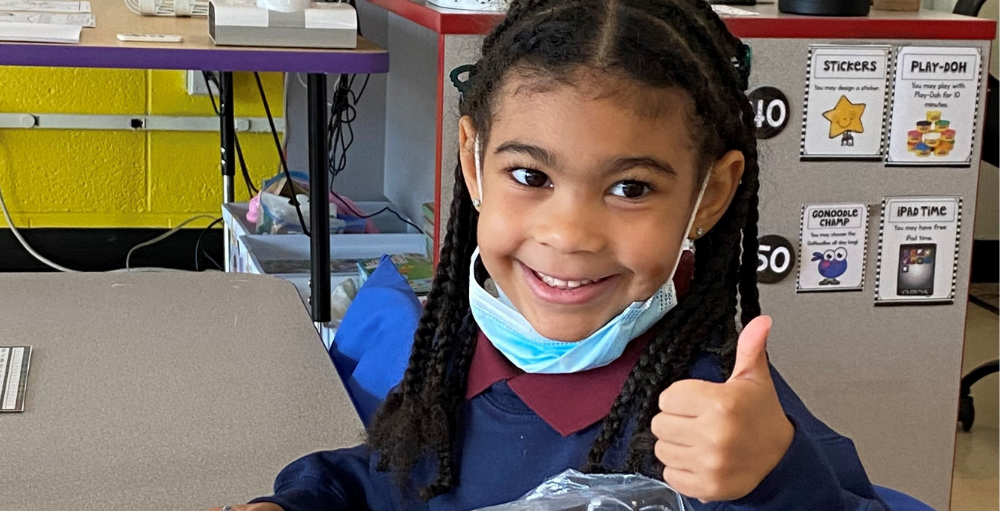 Syracuse Academy of Science and Citizenship elementary school students are all smiles for the second day of the 2021 - 2022 school year.