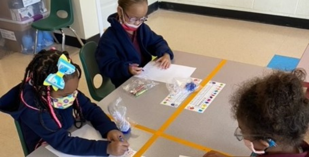 Syracuse Academy of Science and Citizenship kindergarten students practice their pre-writing and listening skills using Amplify’s learning sessions.