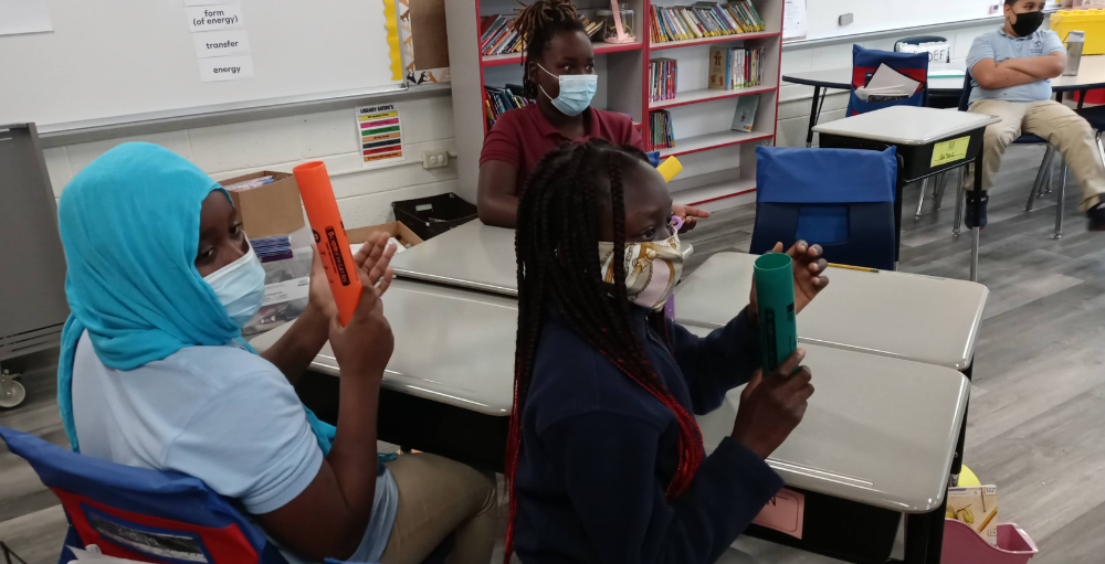 At Syracuse Academy of Science and Citizenship elementary school students explore a variety of percussion instruments including Boomwhackers in their music class. 