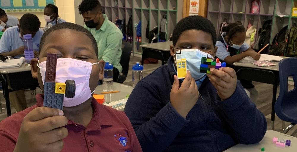 Syracuse Academy of Science and Citizenship elementary school students learn and demonstrated the character strength, teamwork, in a Lego activity with fellow classmates.