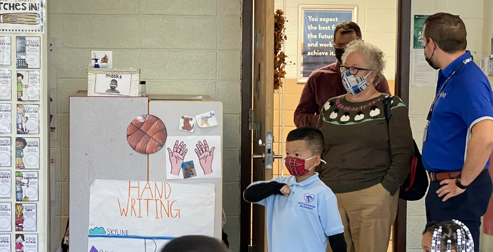 New York State Board of Education’s Board of Regents 5th Judicial District member Elizabeth S. Hakanson listens to a lesson taught by a Syracuse Academy of Science and Citizenship elementary school teacher, while receiving a tour of the school. 