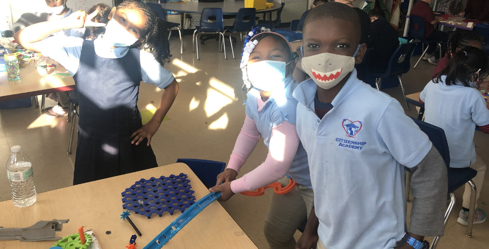 Syracuse Academy of Science and Citizenship elementary school students construct and build objects during their indoor recess.